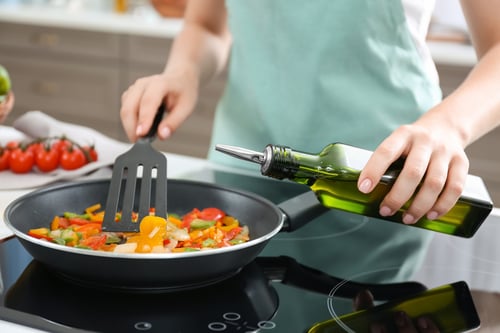 woman_cooking_with_oo_stock