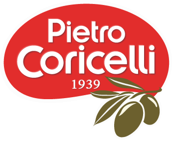 Pietro Coricelli written in white text inside of a red bubble with 1939 written below and an olive branch to the right